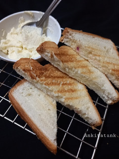A picture of Cheese spread bread toast.