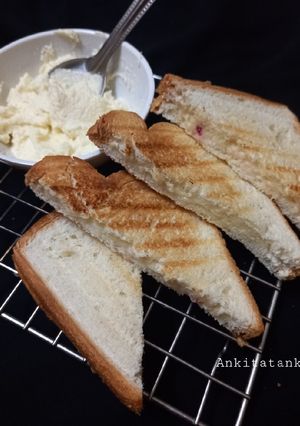 A picture of Cheese spread bread toast.