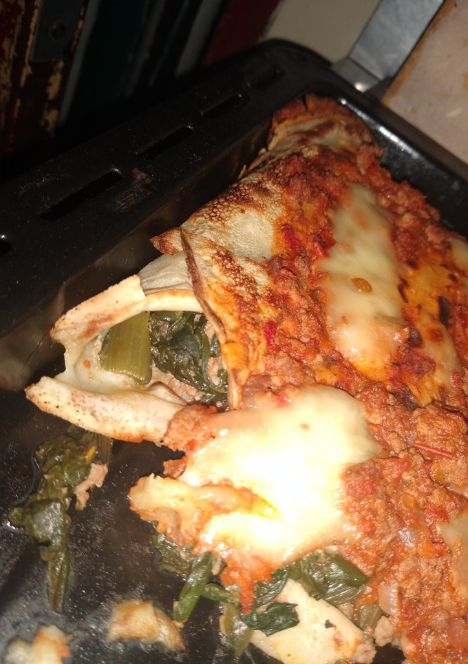 Una foto de Canelones de acelga con bolognesa