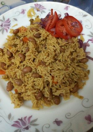 A picture of Mseto served with kachumbari ; mix of beans and rice.