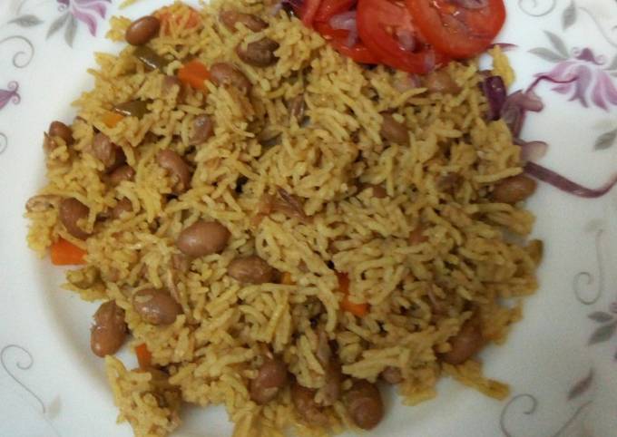 Mseto served with kachumbari ; mix of beans and rice