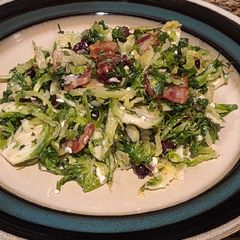 A picture of Brussel Sprout Salad with Bacon and Blue Cheese.