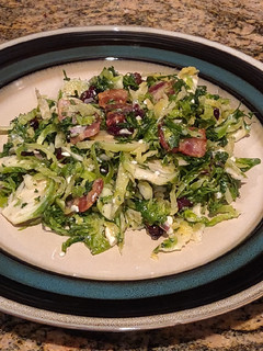 A picture of Brussel Sprout Salad with Bacon and Blue Cheese.