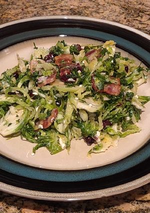 A picture of Brussel Sprout Salad with Bacon and Blue Cheese.