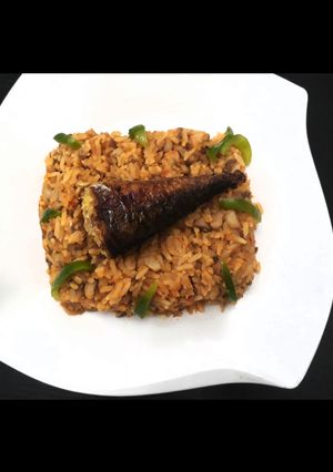 A picture of Beans and rice with smoked fish.