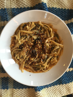 A picture of Linguinne Pasta, Progresso Vegetable Classic Soup and Leftover Dandelion Greens.