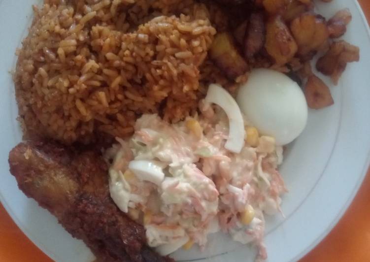 Coconut Jollof Rice with Cole slaw and other side attraction