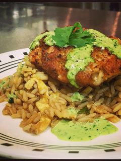 A picture of Crispy Rock Shrimp Cakes with a Cilantro Jalapeno Green Sauce.