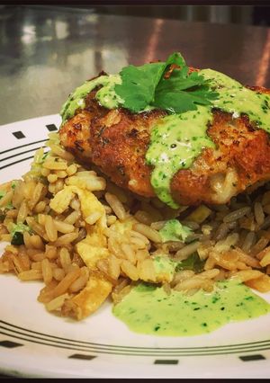 A picture of Crispy Rock Shrimp Cakes with a Cilantro Jalapeno Green Sauce.