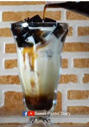A picture of Grass Jelly Snow Ice with Fresh Milk and Caramel Sauce.