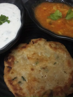 A picture of Vrat waale Aloo and Samak rice roti with dhania curd.