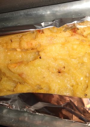 Una foto de Puré de papas con tocino y parmesano