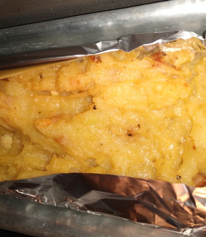 Una foto de Puré de papas con tocino y parmesano