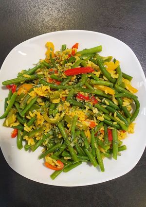 Une photo de Poêlée riz haricots vert poivrons