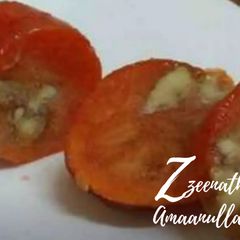 Frozen Persimmons with stuffed Walnuts A picture of Frozen Persimmons with stuffed Walnuts.