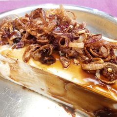 A picture of Steamed Tofu with Fried Shallots and Oyster Sauce.