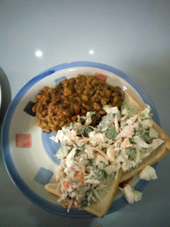A picture of Beans bread and salad.