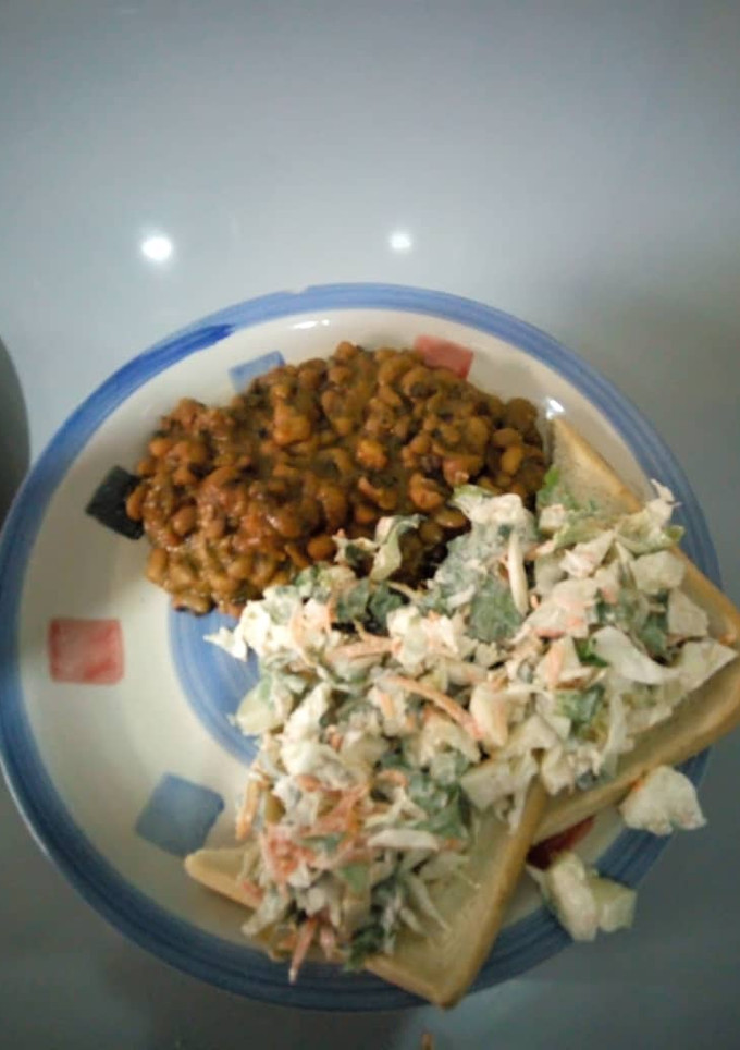 A picture of Beans bread and salad.