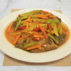 A picture of Ikan Nila Bumbu Acar Kuning.