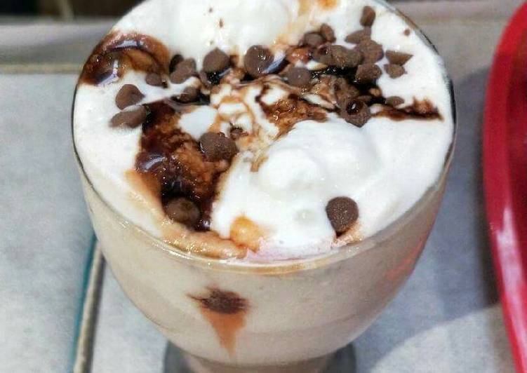 Hot chocolate milk with vanilla Ice-Cream and choco-chips on top