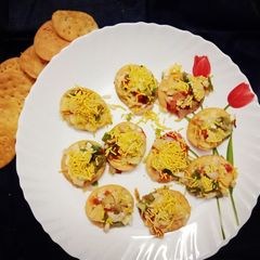 A picture of Papdi pizza with salsa topping.