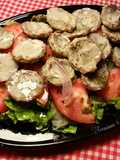 Ensalada de medallones de mini alcachofas silvestres con tomates orgánicos