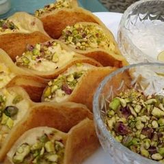 Qatayef (middle Eastern dessert) A picture of Qatayef (middle Eastern dessert).