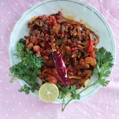 A picture of Fry bitter gourd and onion tomato masala/ tasty yammy masalydar.