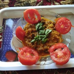 A picture of Masala chole (kale) with dahi.