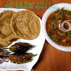'Aloo sabzi & spicy puri' (potato curry & Indian fried bread) A picture of 'Aloo sabzi & spicy puri' (potato curry & Indian fried bread).
