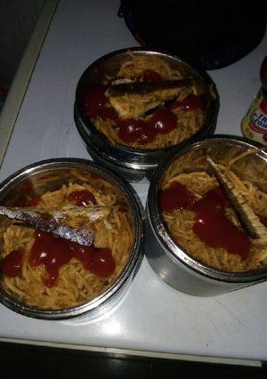 A picture of Spaghetti jolof with fish.