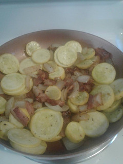 A picture of Summer squash with bacon.