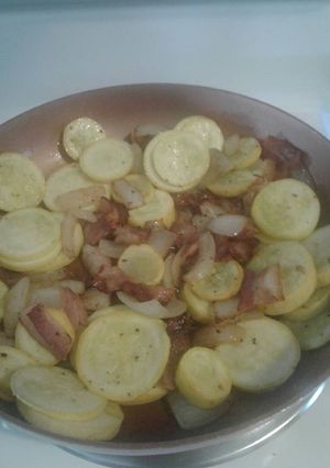 A picture of Summer squash with bacon.