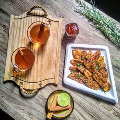 A picture of Masala wedge fries with Arabic cinnamon tea.