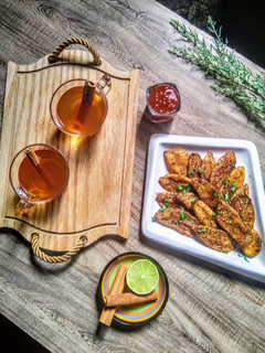 A picture of Masala wedge fries with Arabic cinnamon tea.