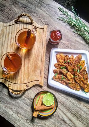 A picture of Masala wedge fries with Arabic cinnamon tea.