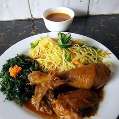 A picture of Noddles with steamed kales and chicken.