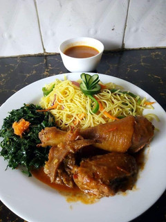 A picture of Noddles with steamed kales and chicken.