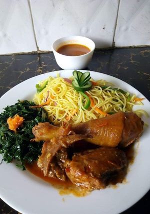 A picture of Noddles with steamed kales and chicken.