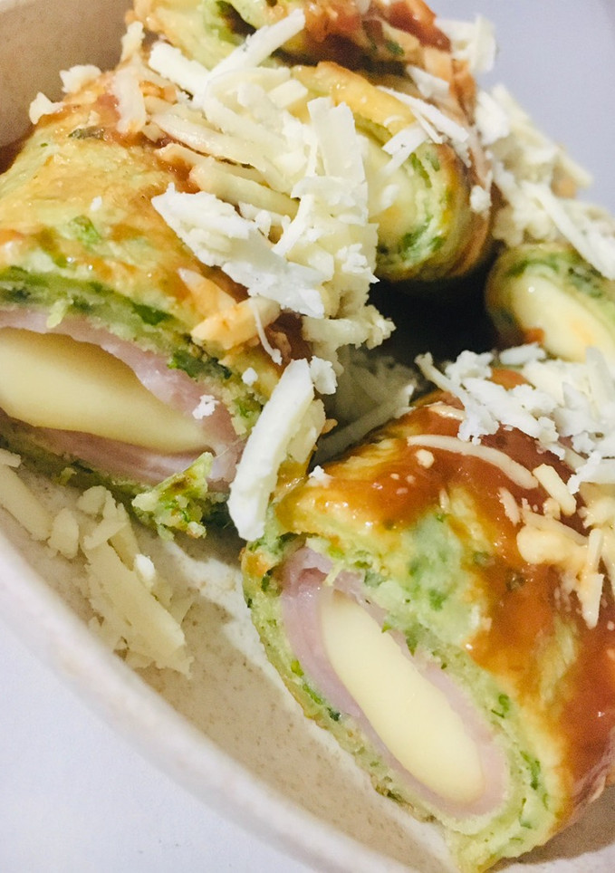 Una foto de CANELONES DE 🥞PANQUEQUES 🥞 VERDES RELLENOS DE 🍖JAMÓN Y QUESO 🧀😋🤩👏