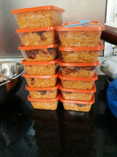 A picture of Jollof rice plantains and salad.