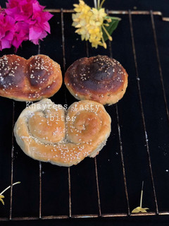A picture of Cinnamon rolls,palmier,and challah rustic dinner rolls.