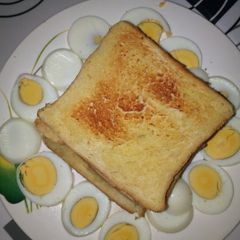 A picture of Butter Toasted Bread with Boiled Eggs.