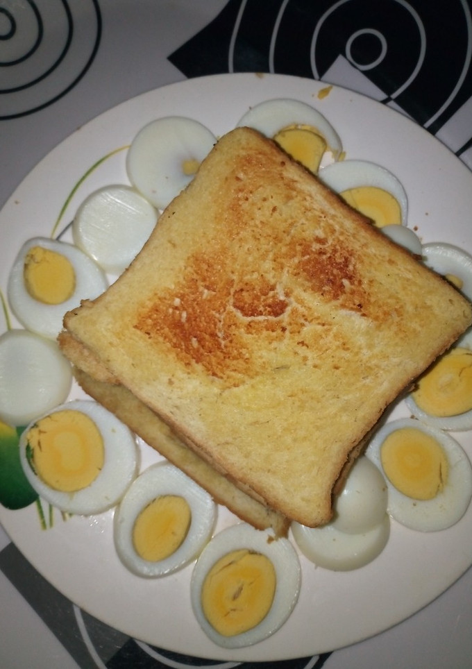 A picture of Butter Toasted Bread with Boiled Eggs.