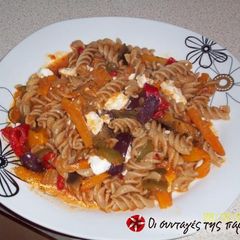 A picture of Mediterranean penne with eggplant, feta cheese and tomato.