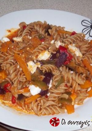 A picture of Mediterranean penne with eggplant, feta cheese and tomato.