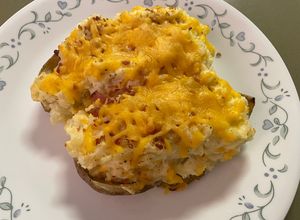 Una foto de Papas con Queso al Horno 🥓