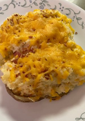 Una foto de Papas con Queso al Horno 🥓