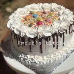 A picture of Chocolate cake with whipped cream frosting.