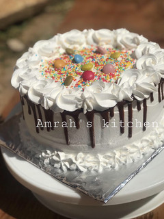 A picture of Chocolate cake with whipped cream frosting.